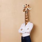 Portrait_of_giraffe_woman_dressed_up_white_collar_style,_standing_her_arms_folded,_against_background_with_copy-space,_concept_of_office_worker