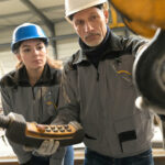 Steelwork_instructor_with_young_apprentice_in_workshop