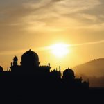 A_silhouette_of_a_mosque_sunset_background